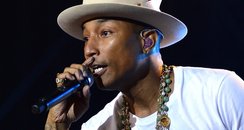 Pharrell performing on stage 